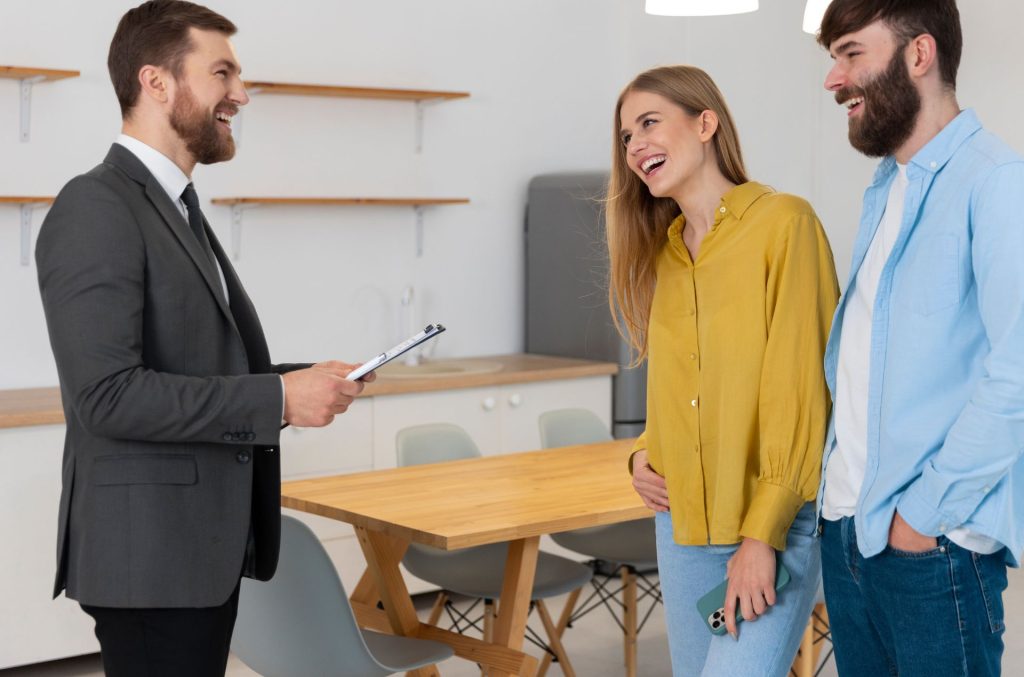 why real estate agents recommend home staging, Real estate agent discussing a staged home with buyers during a property inspection